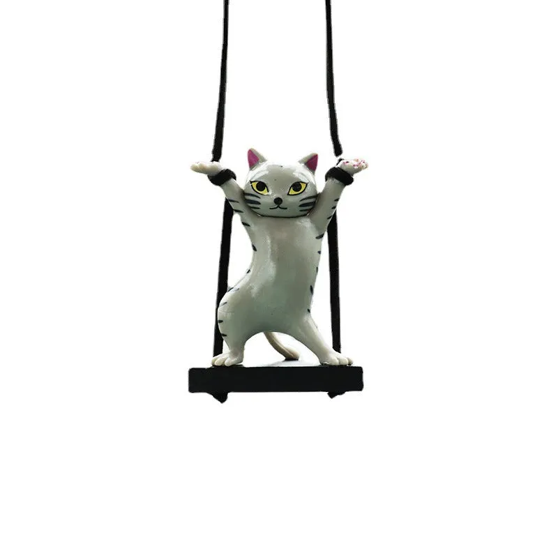 Cartoon-style resin cat pendant for car interior decoration in various colours with adjustable rope.