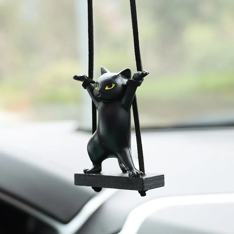 Cartoon-style resin cat pendant for car interior decoration in various colours with adjustable rope.