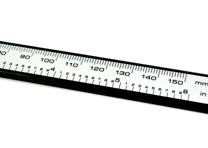 Digital vernier caliper with metal casing, stainless steel guide track, and LCD display showing measurement