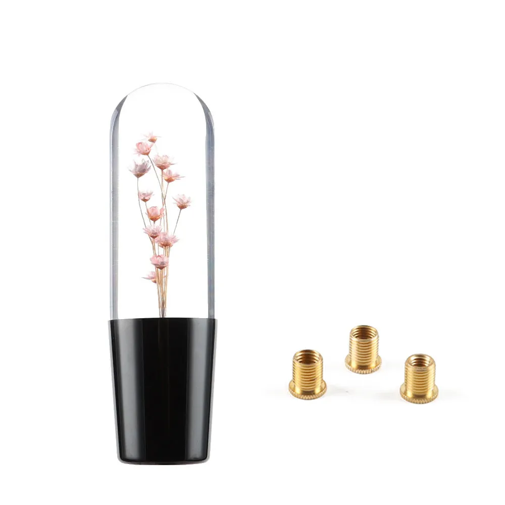 15cm tall transparent crystal car gear knob with internal flower decoration on a gear lever