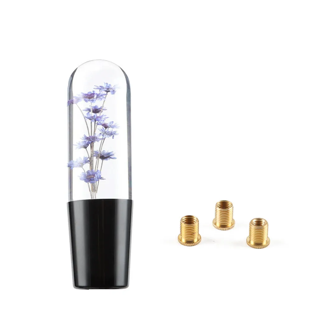 15cm tall transparent crystal car gear knob with internal flower decoration on a gear lever