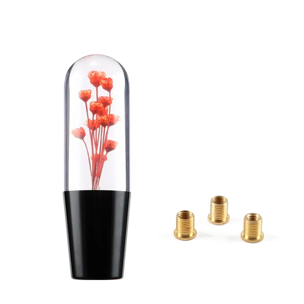15cm tall transparent crystal car gear knob with internal flower decoration on a gear lever