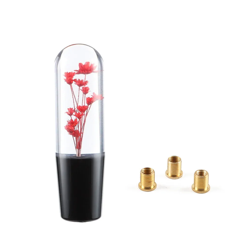 15cm tall transparent crystal car gear knob with internal flower decoration on a gear lever
