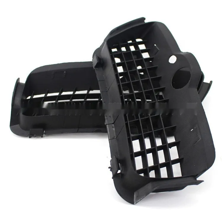 Pair of black ABS plastic Volkswagen Golf 3 front bumper fog light covers.