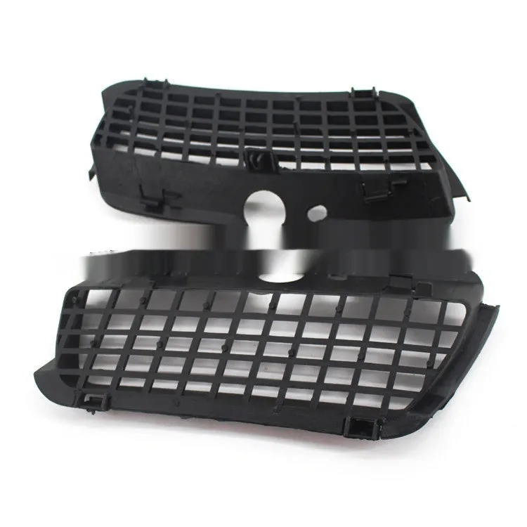 Pair of black ABS plastic Volkswagen Golf 3 front bumper fog light covers.