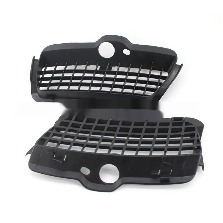 Pair of black ABS plastic Volkswagen Golf 3 front bumper fog light covers.