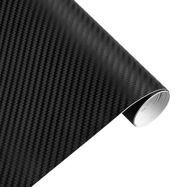 3D carbon fibre car sticker roll in black with textured pattern on a white background