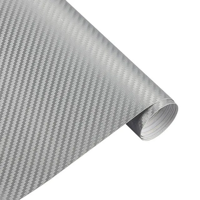 3D carbon fibre car sticker roll in black with textured pattern on a white background