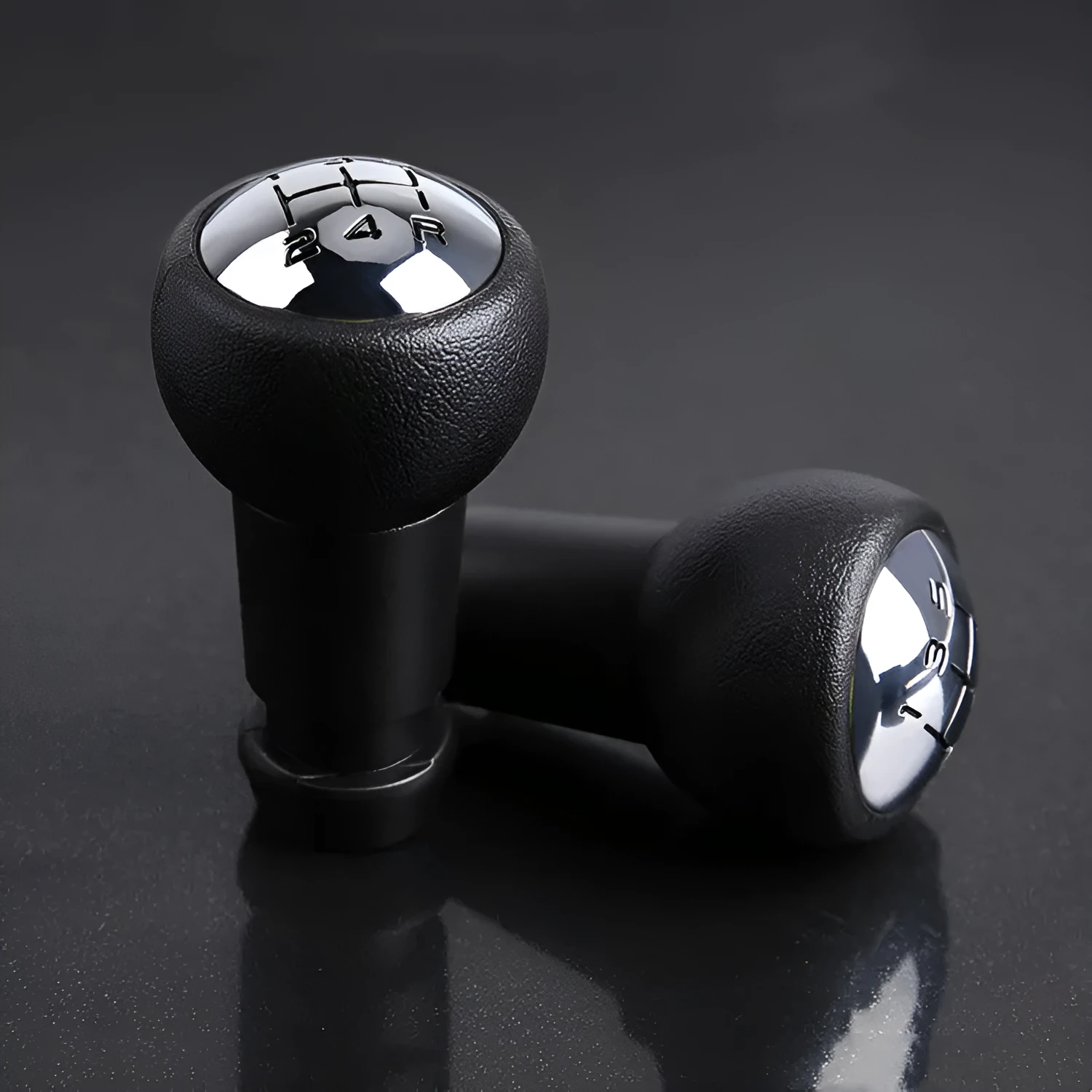 Black GM universal manual transmission gear head on a shift lever