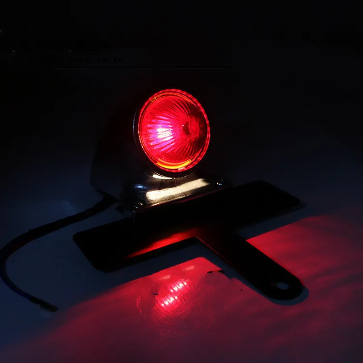 Silver aluminium alloy Lucas-style motorcycle taillight brake light with red lens and 36cm cable on white background