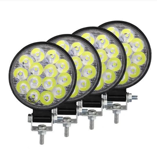 Compact round aluminium LED work light with white light, suitable for vehicle mounting.