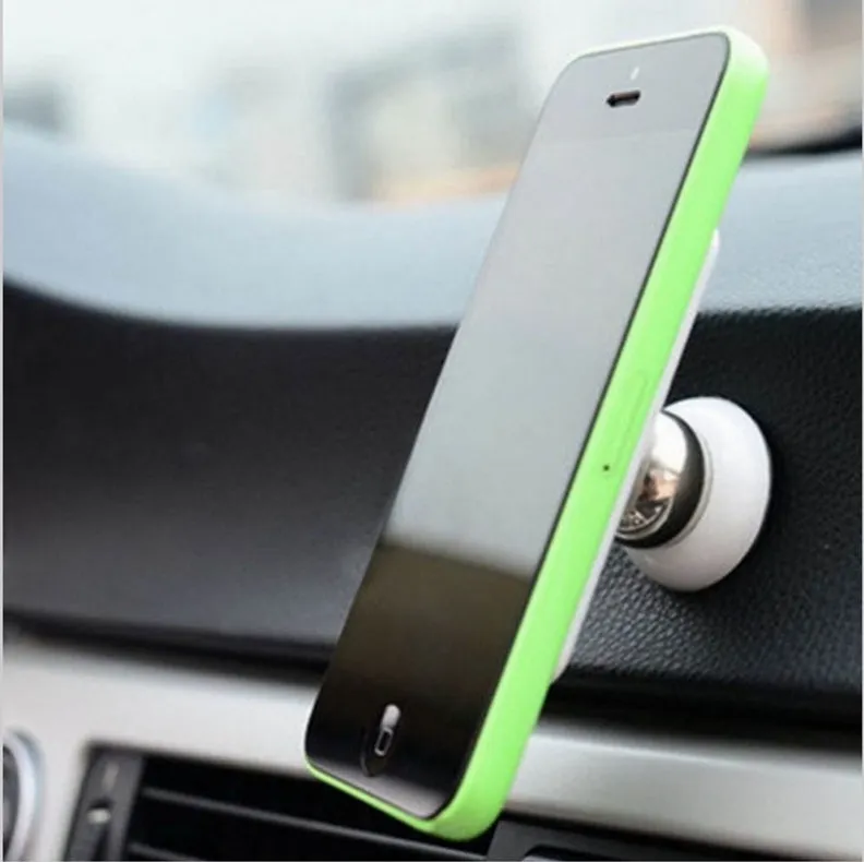 Magnetic car phone holder in black with alloy metal construction on car dashboard