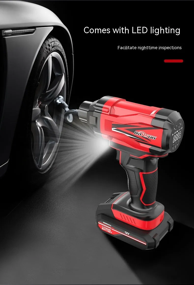 Red and black portable car tyre air pump with display, nozzles, and power cables on a table.