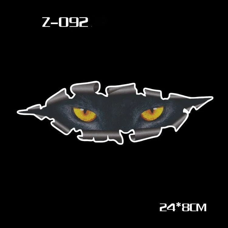 Pair of reflective cartoon car stickers with cute eyes on a car rearview mirror.
