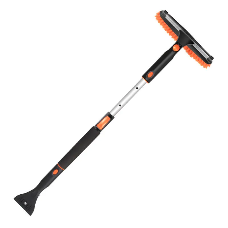 Car snow plough shovel set with plastic shovel, brush, telescopic rod, and frost scraper on a snowy car windscreen