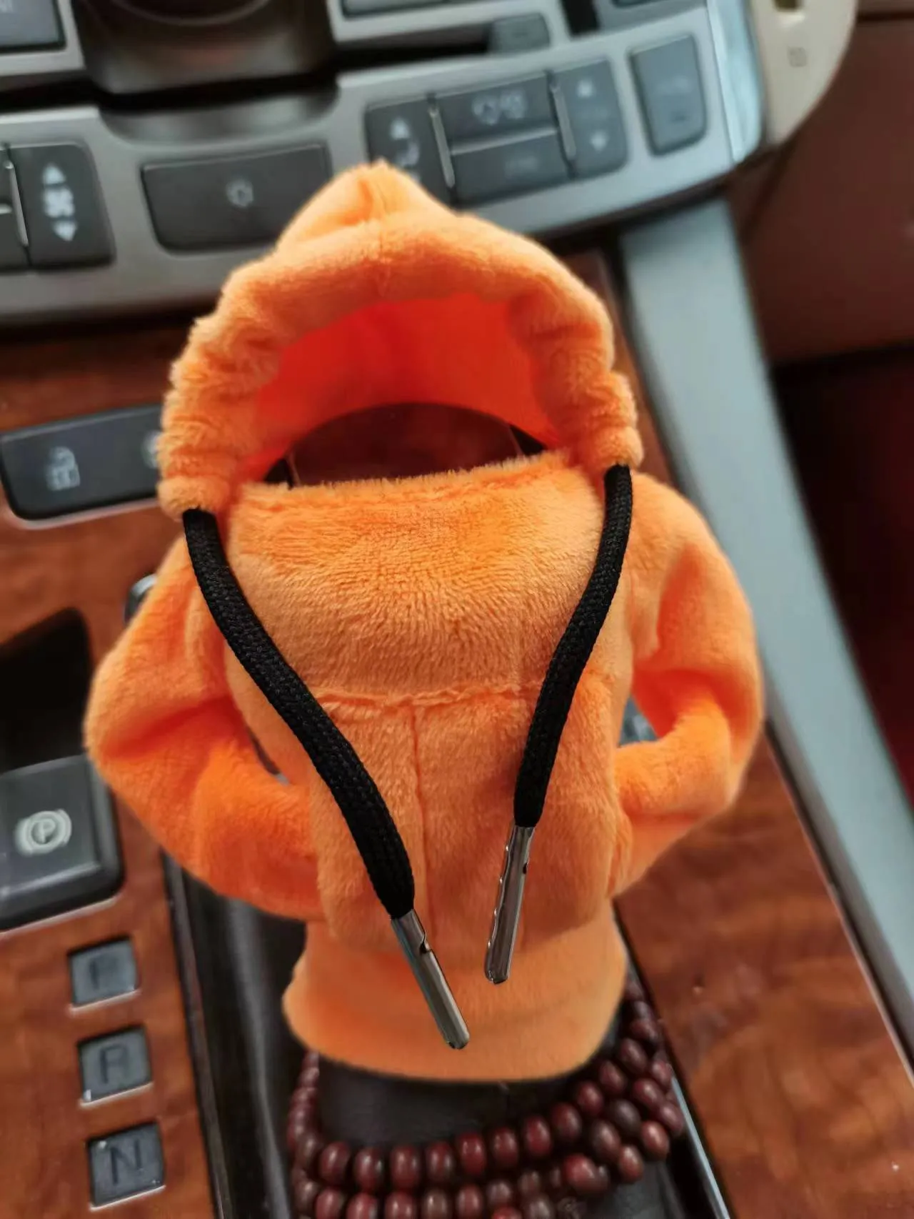 Dutch velvet car gear handle sleeve and handbrake cover in various colours on a car interior.