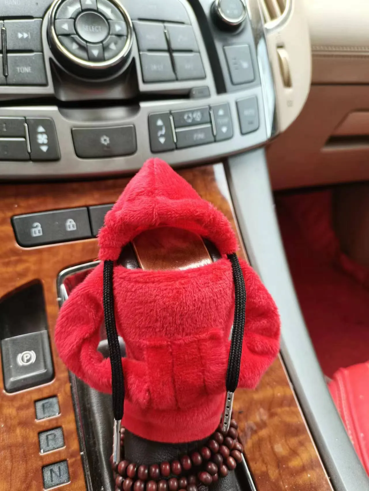 Dutch velvet car gear handle sleeve and handbrake cover in various colours on a car interior.