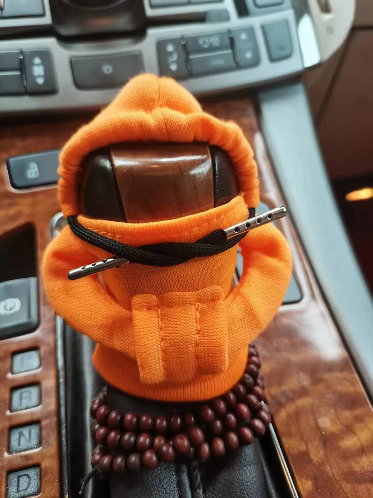 Dutch velvet car gear handle sleeve and handbrake cover in various colours on a car interior.