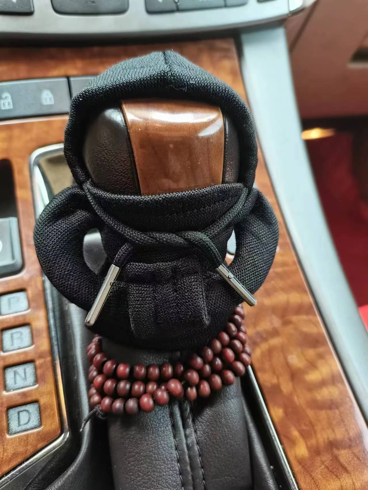 Dutch velvet car gear handle sleeve and handbrake cover in various colours on a car interior.