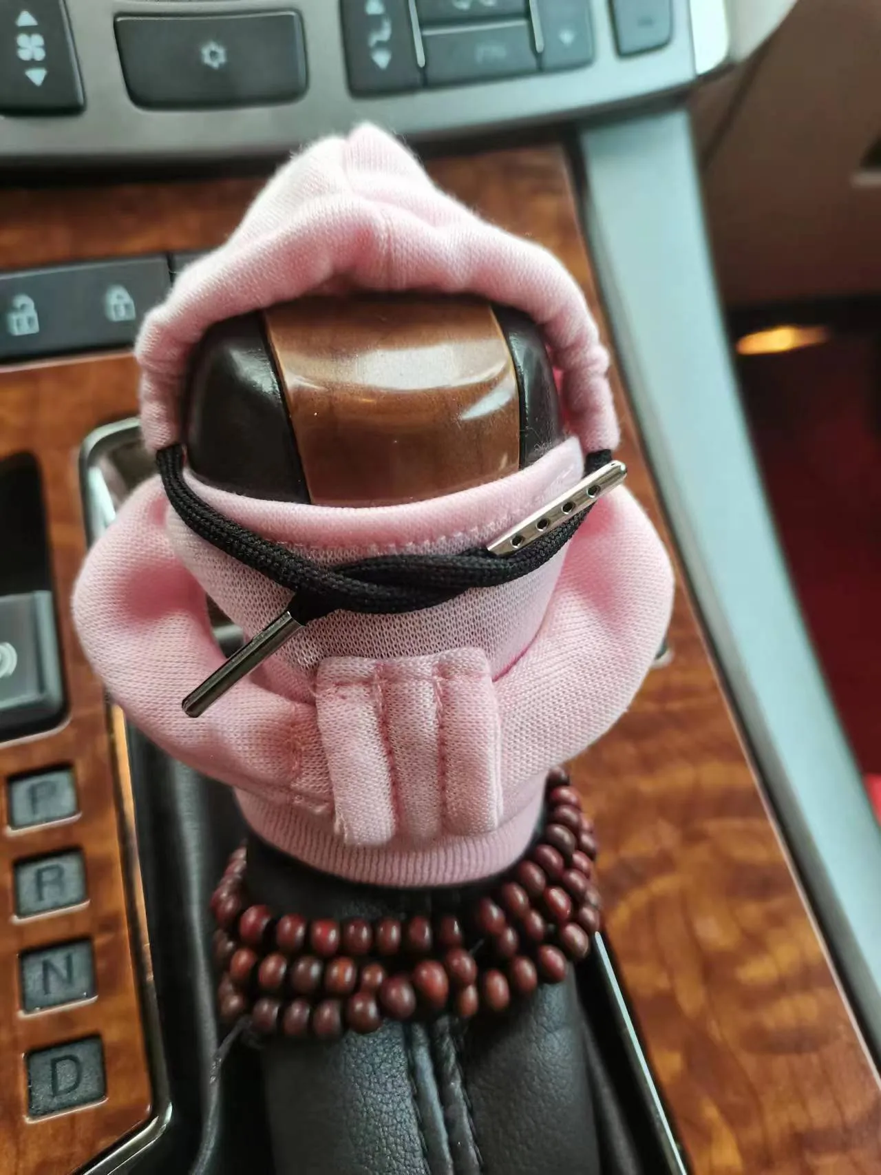 Dutch velvet car gear handle sleeve and handbrake cover in various colours on a car interior.