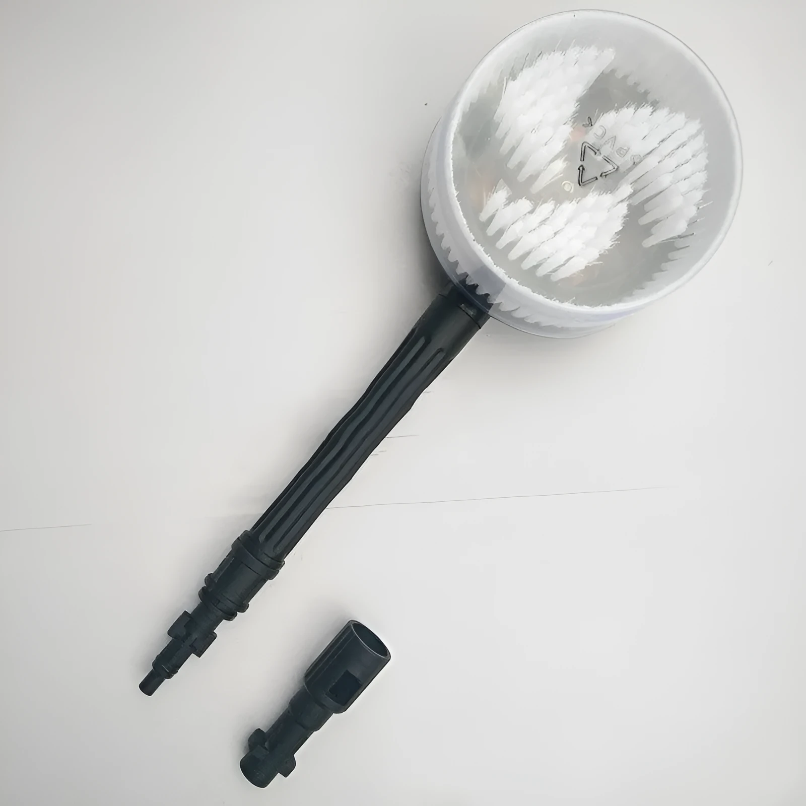 Automatic car washing rotating brush with water gun and three nozzle options on a car surface