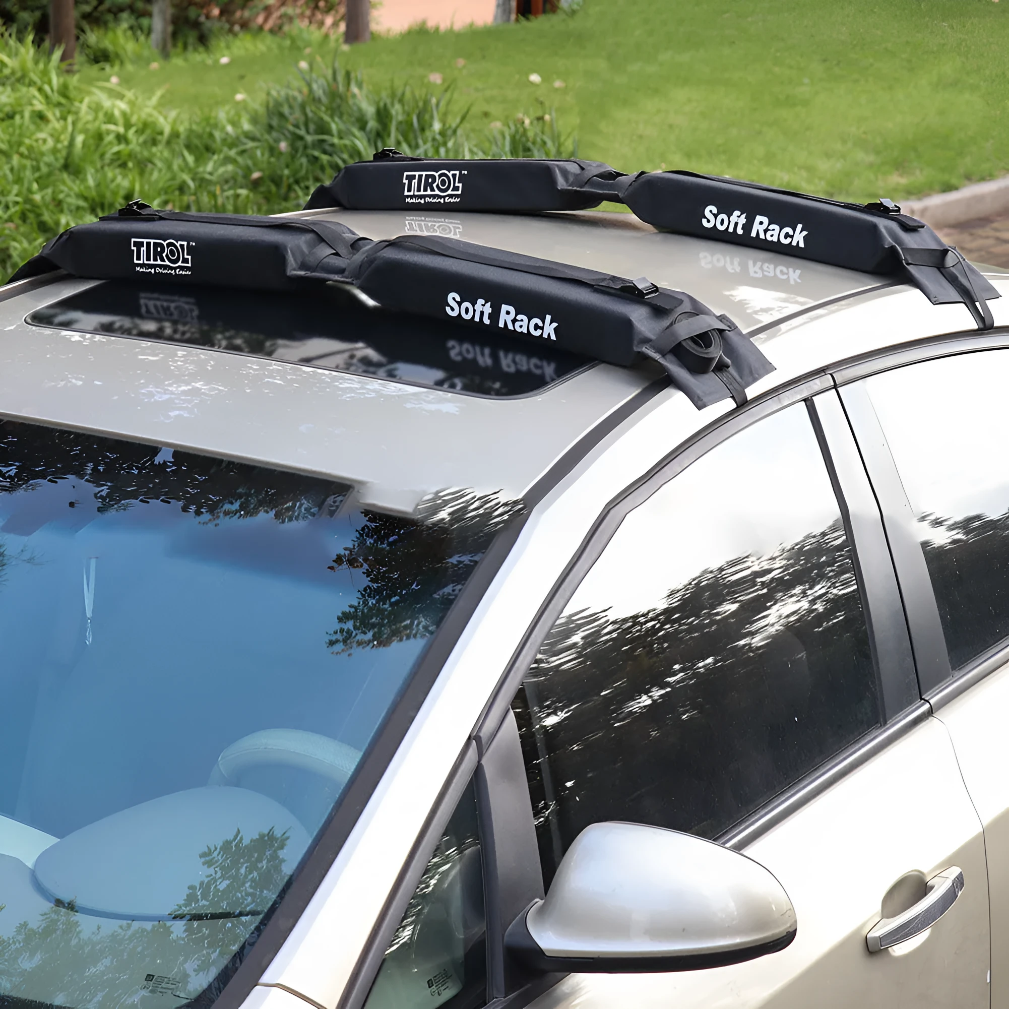 Black folding soft roof rack on a car roof, made of 600D Oxford cloth, with webbing straps and metal buckles