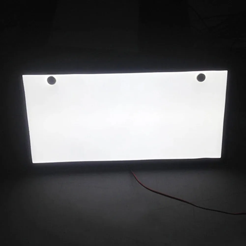 Two white LED truck licence plate lights with flat thin plastic housings and visible LED lamp bars.