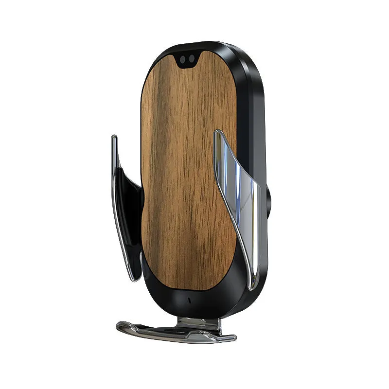 Black 15W smart car phone holder with wireless charging and infrared sensor on car dashboard