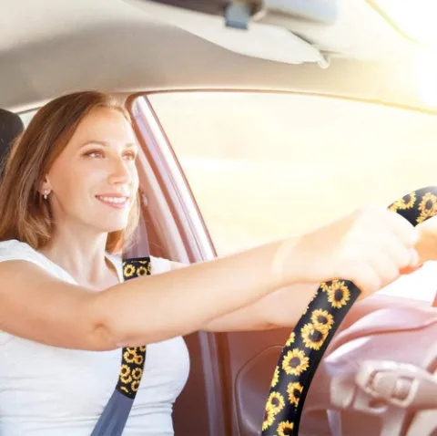 Sunflower steering wheel cover on car steering wheel with matching keychain and vent decoration
