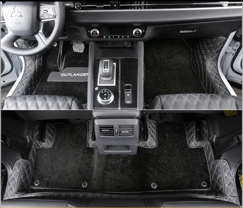 Mitsubishi Outlander full surround floor mats in black, fitted in a car footwell.