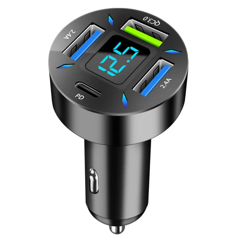 Black four-port car USB charger with LED digital display plugged into a vehicle socket.