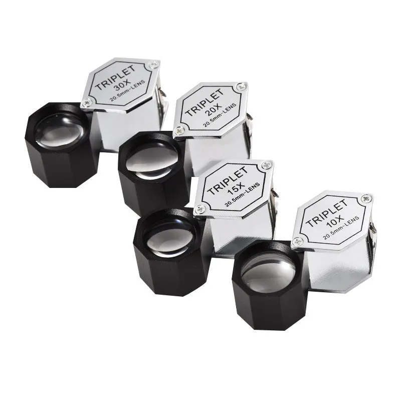 Handheld portable metal magnifying glass with optical glass lens for jewellery and coin identification.