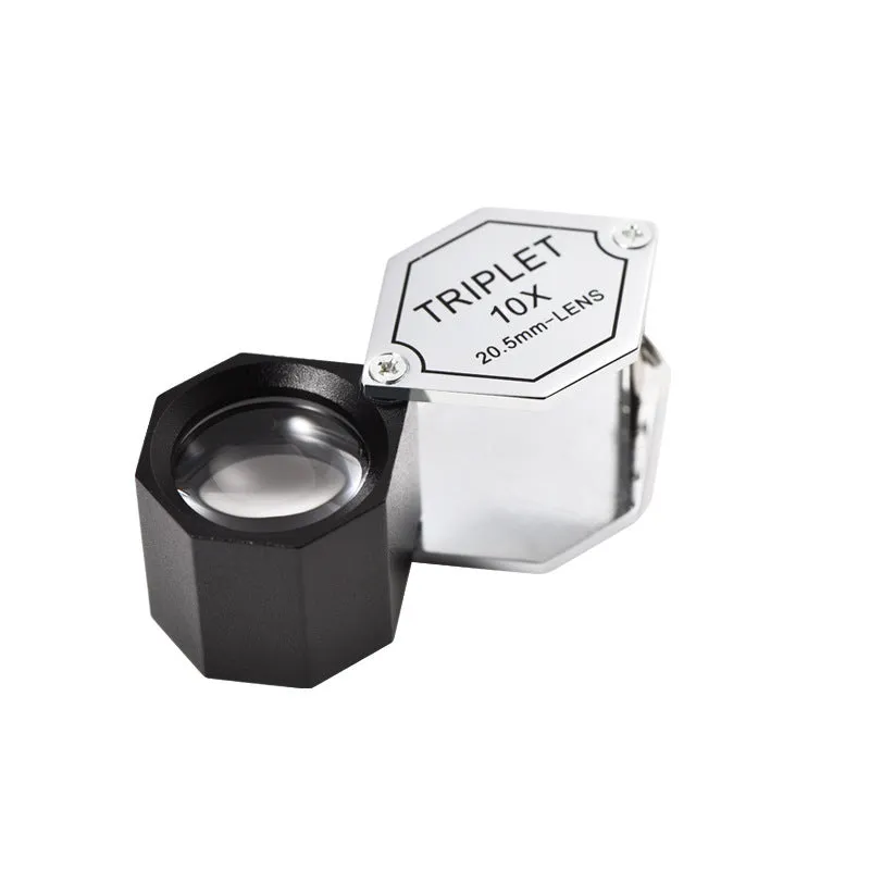 Handheld portable metal magnifying glass with optical glass lens for jewellery and coin identification.