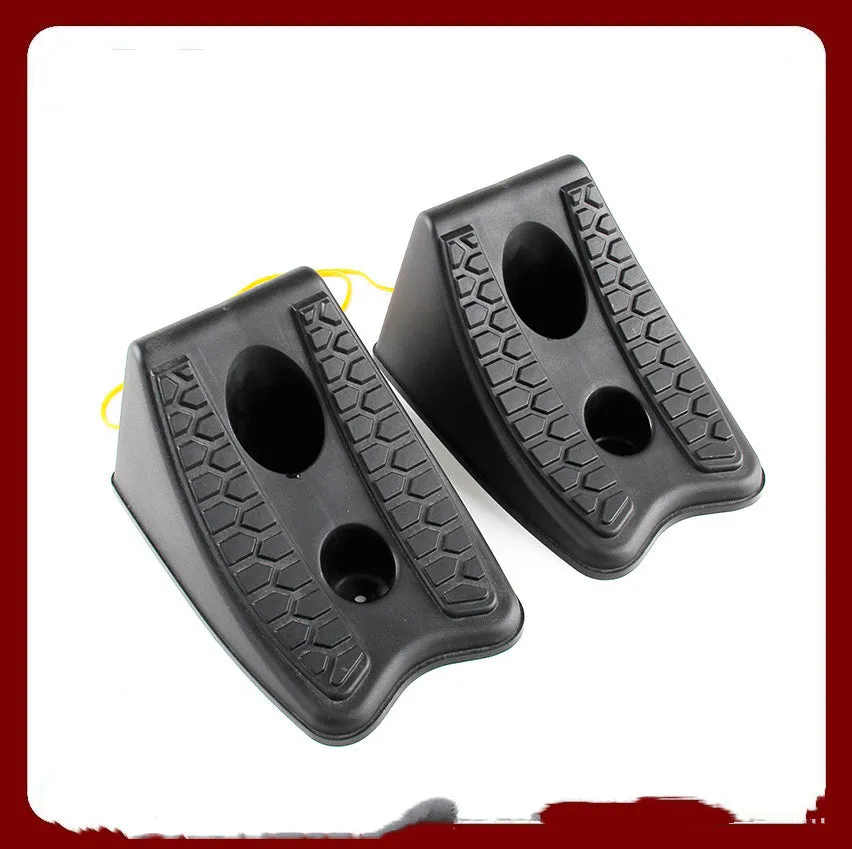 Black rubber automobile universal wheel stopper with triangular anti-slip base on sloped ground