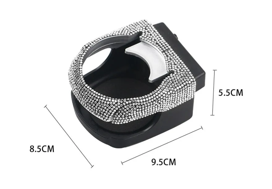 White diamond-decorated car cup holder bracket clipped onto a vehicle air vent.
