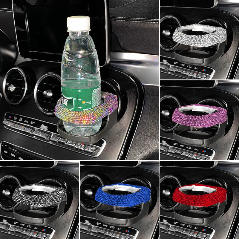 White diamond-decorated car cup holder bracket clipped onto a vehicle air vent.