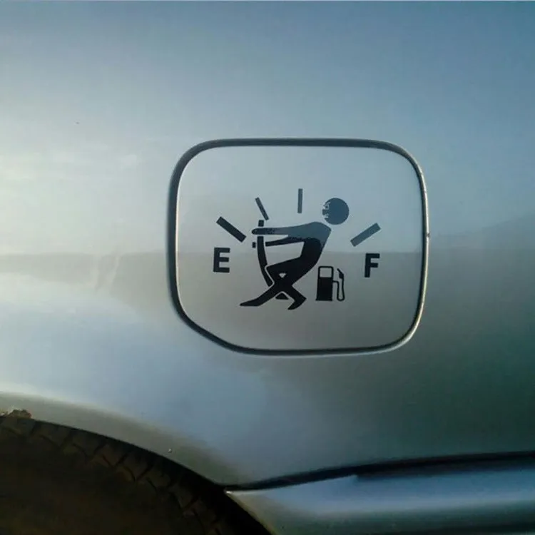 Reflective insufficient fuel car sticker 12.7cm x 9cm in black on a car dashboard