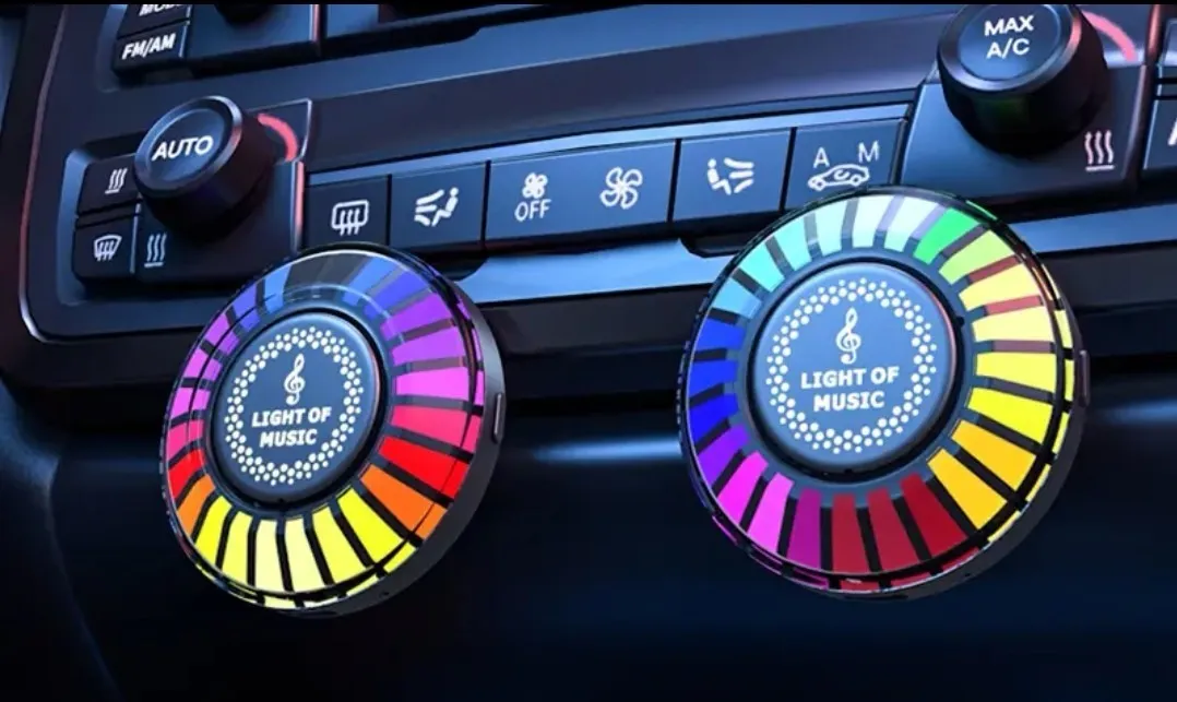 Car air vent clip-on aromatherapy unit with RGB 3D projection light.