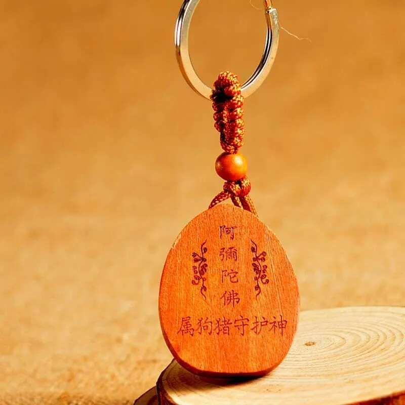 Eight patron saint keychains in natural Taomu wood, peach wood colour, 10x3.2x4cm size, orange colour option available