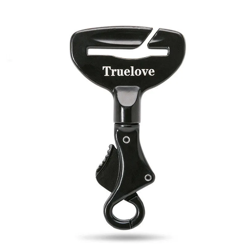 Black aluminium alloy dog car seat belt lock with 5cm tab resting on car seat