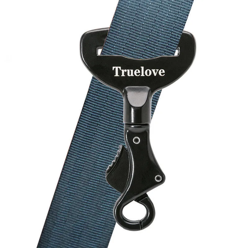 Black aluminium alloy dog car seat belt lock with 5cm tab resting on car seat