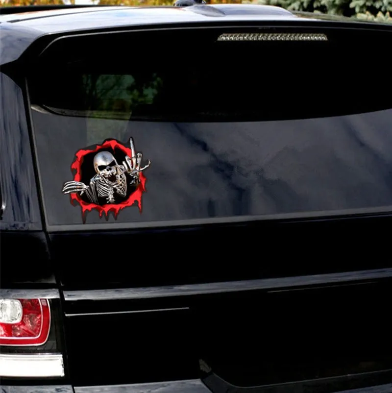 Colourful broken shell peeping metal skull design on a 15cm by 14cm car bumper sticker.