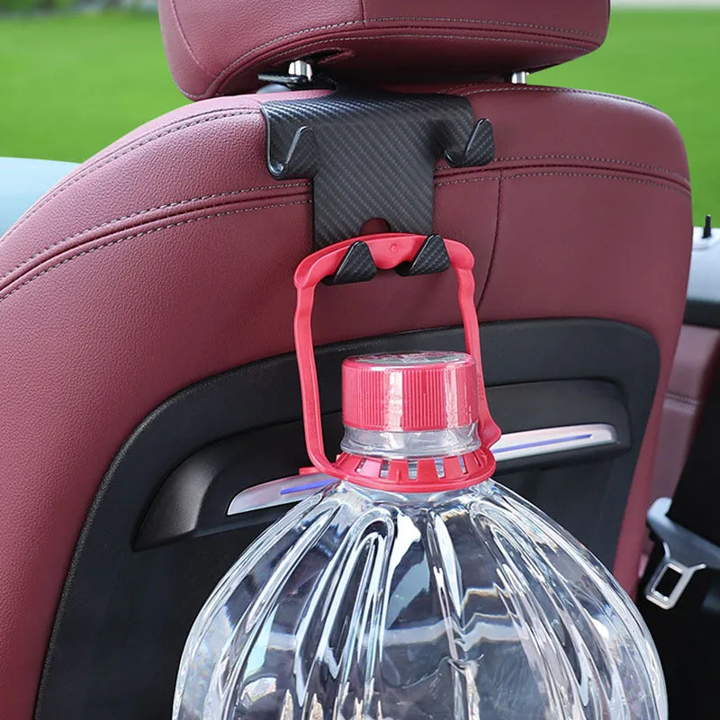 Black ABS plastic car hook and mobile phone holder bracket for rear seat back storage.