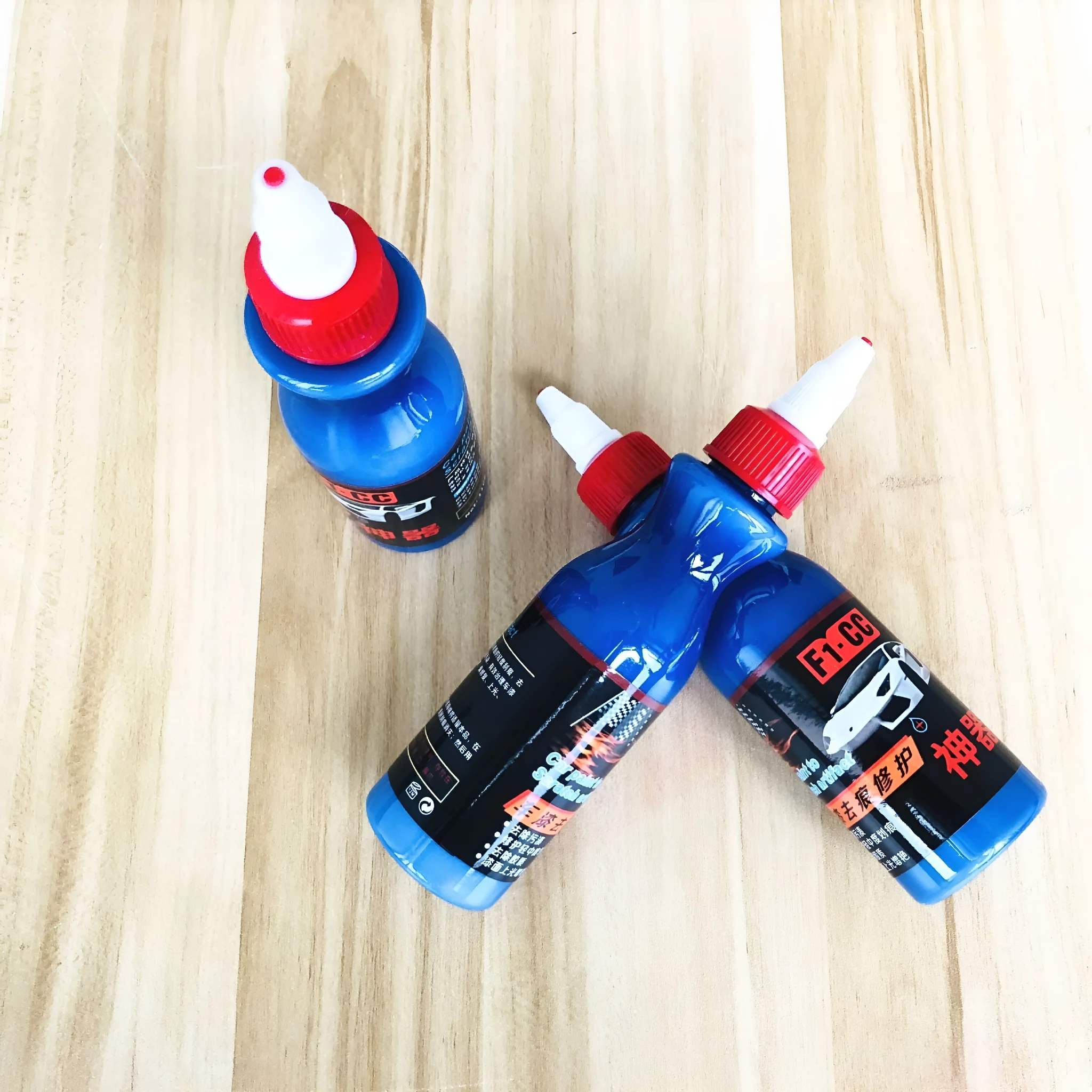 Automotive scratch repair agent bottle for vehicle paint touch-ups and minor scratch repair