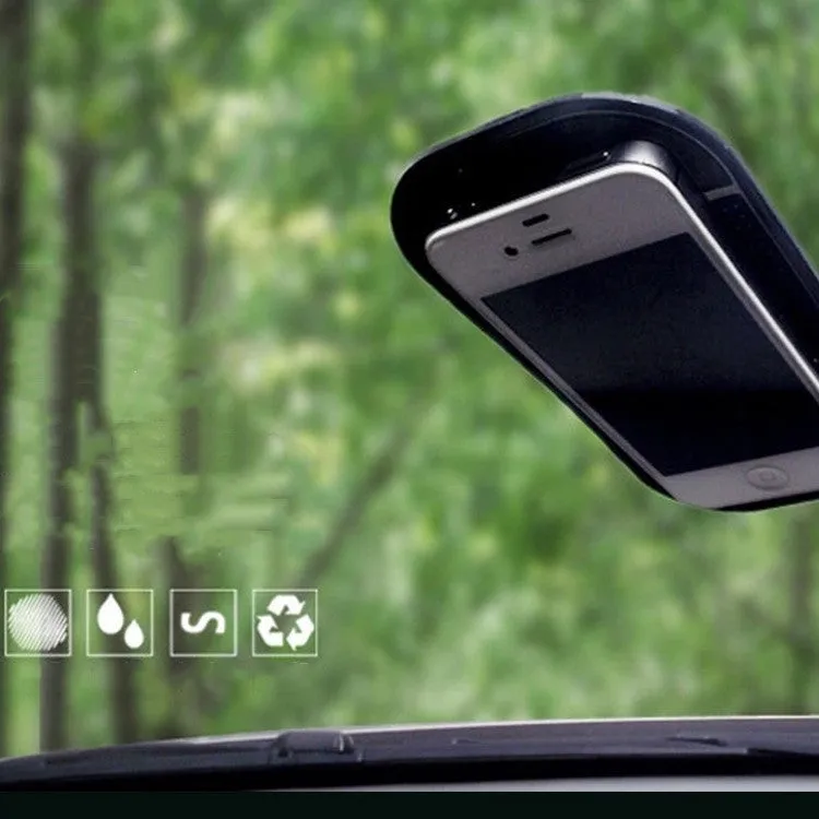 Black silicone car anti slip mat with spider-web texture, 13x7cm, on a car dashboard holding a smartphone