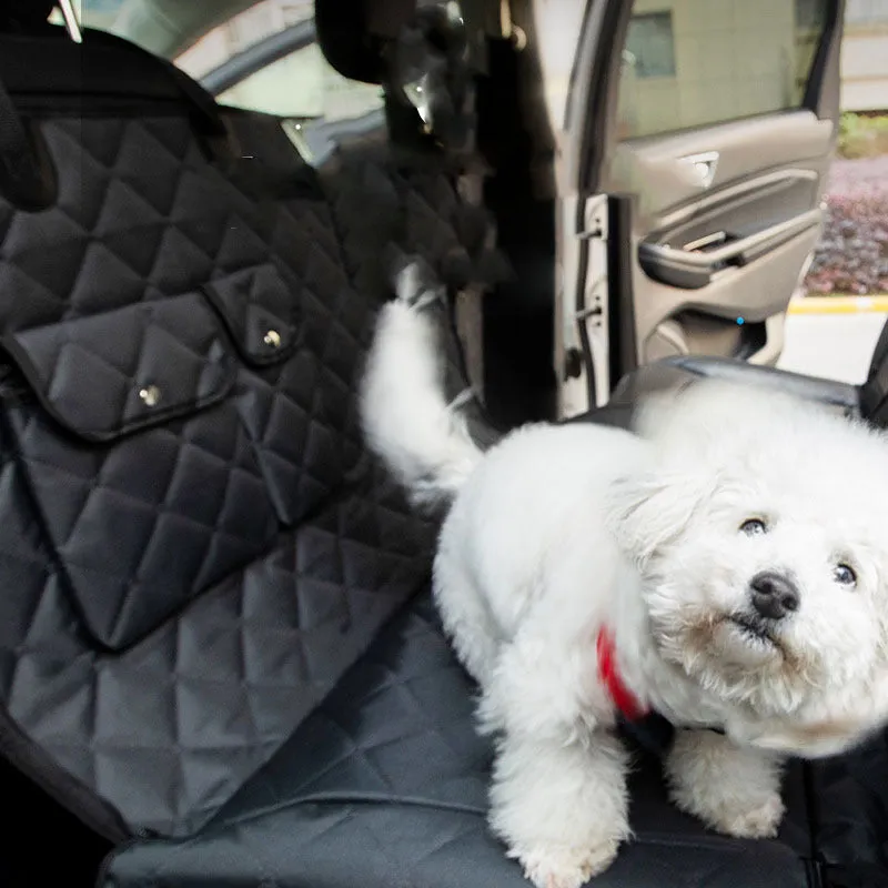 Black polyester two-seater car rear pet mat, waterproof and scratch-resistant, laid across a car seat