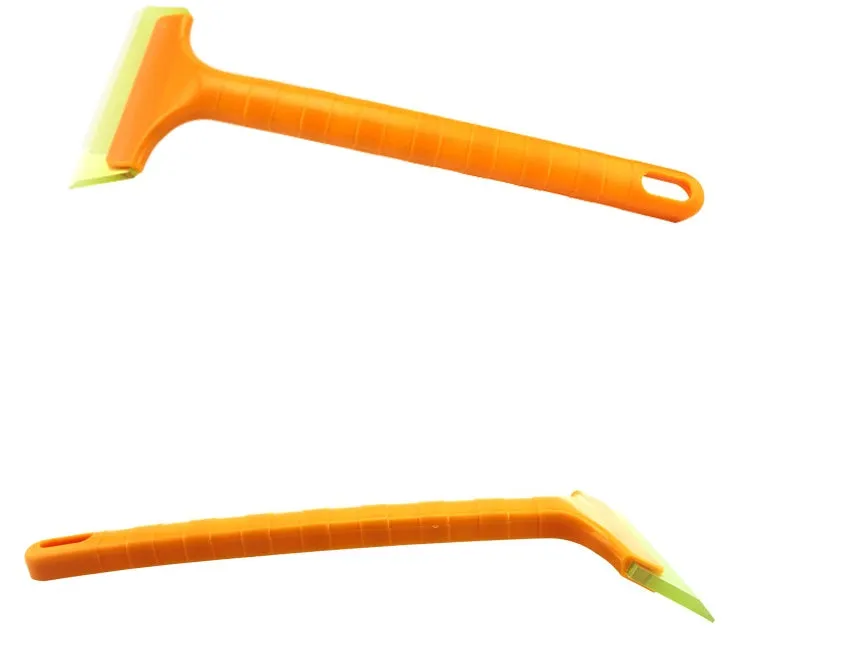 Yellow plastic car snow shovel for ice removal, 32cm length, on a dark background