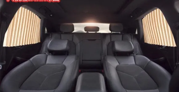 Magnetic car curtain sun shade in black attached to vehicle side window