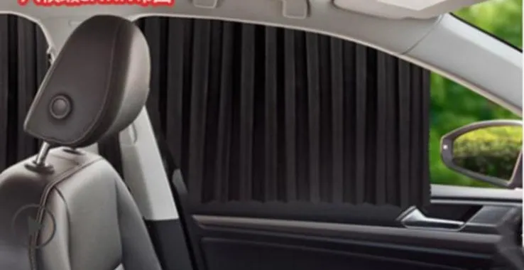 Magnetic car curtain sun shade in black attached to vehicle side window