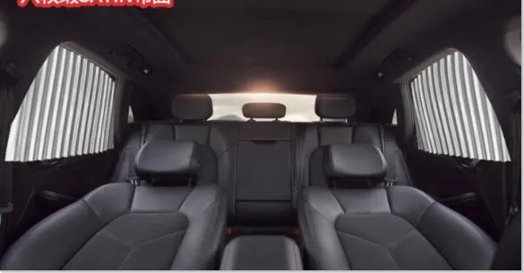Magnetic car curtain sun shade in black attached to vehicle side window